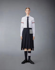 THOM BROWNE Below Knee Dropped Back Pleated Skirt Navy on figure front