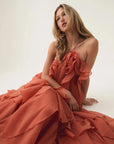 aje Pandorea Layered Maxi Dress coral clay on figure front seated