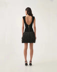 aje Rushes Raffia Knit Mini Dress black on figure back