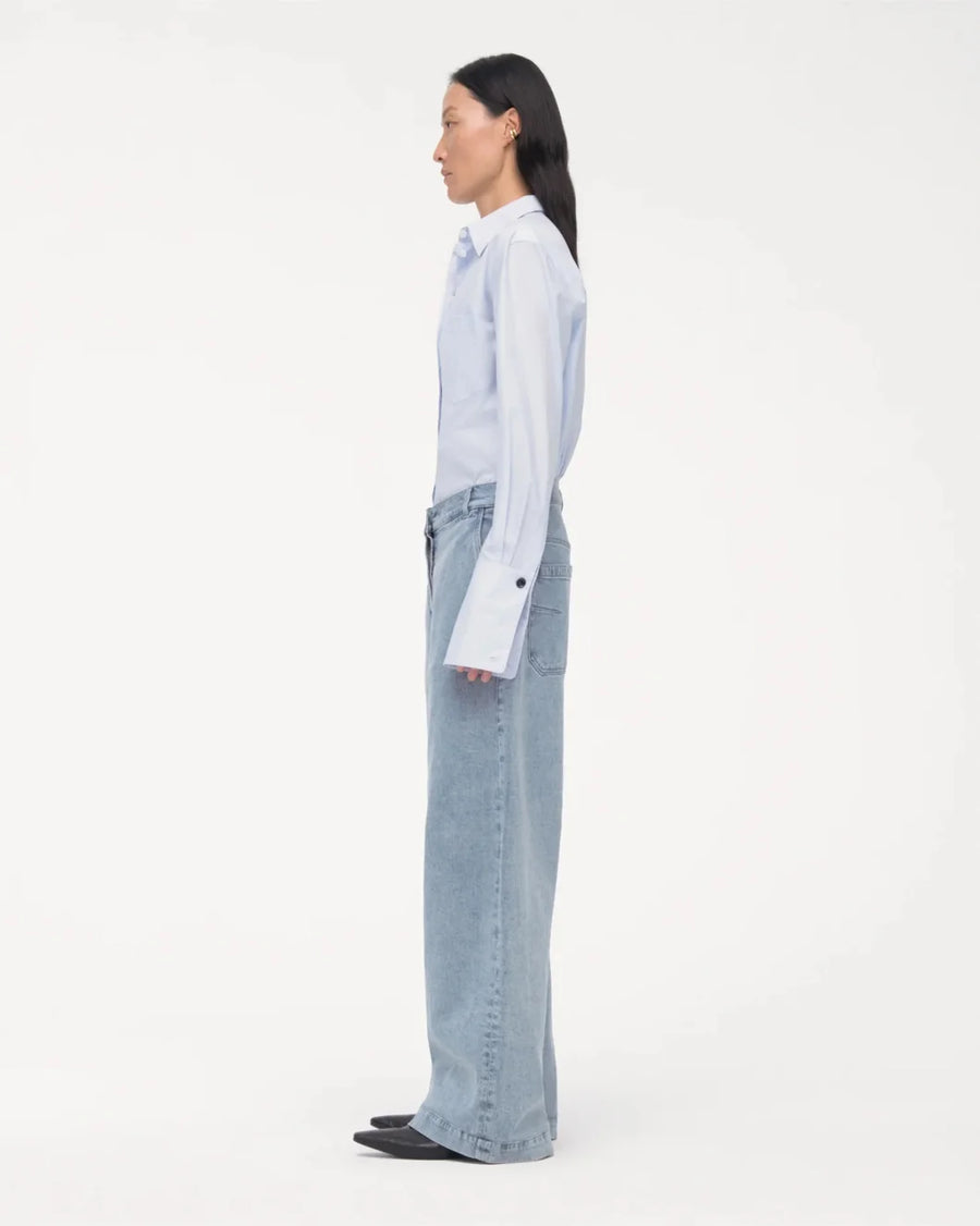 another tomorrow light wash Carpenter Denim Pant on figure side