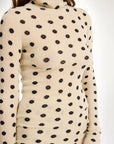 by malene birger fioria turtleneck wool sweater graphic flower cream on figure side detail