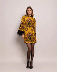 cara cara vida dress dusty gold fleur print on figure front