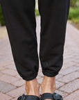 Frank and Eileen Eamon Jogger black on figure front detail