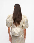 ganni Metallic Cloque Peplum Blouse gold and silver on figure back