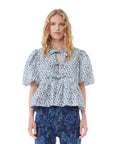 ganni floral printed cotton poplin peplum blouse glacier lake blue on figure front detial