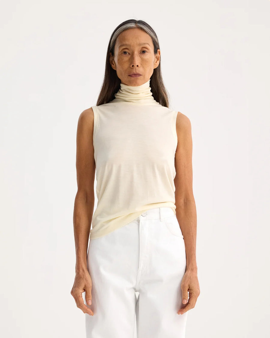 rohe Light Weight Spring Merino Wool Sleeveless Turtleneck cream on figure front