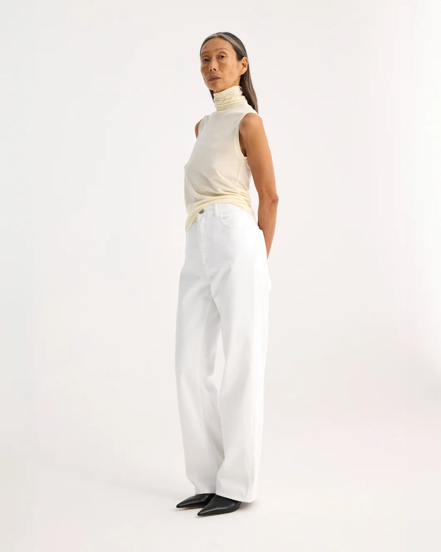 rohe Light Weight Spring Merino Wool Sleeveless Turtleneck cream on figure side