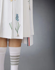 thom browne CLASSIC COTTON LINEN BOTANICAL FLOWER PLEATED SKIRT on figure front detail