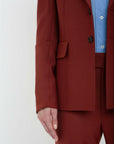 victoria beckham sleeve detail pocket jacket in russet on figure front