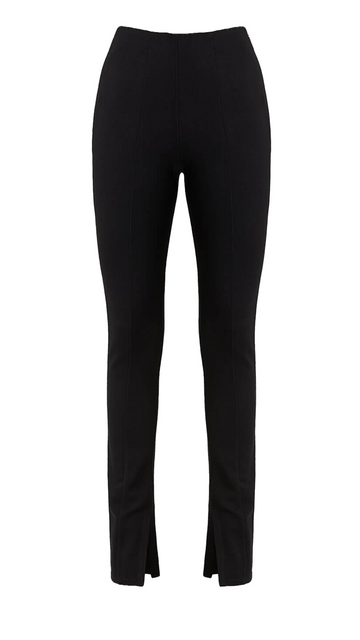 Anine Bing Max pant is in the color black, high-waisted, with slit at the hems.